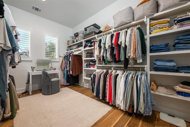 spacious closet featuring hardwood / wood-style flooring