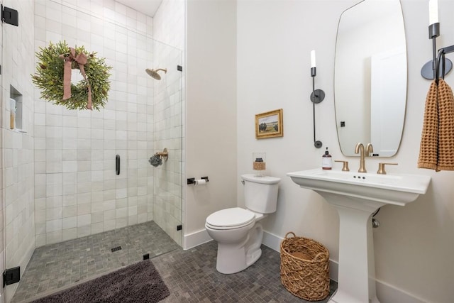 bathroom with tile patterned floors, toilet, and an enclosed shower