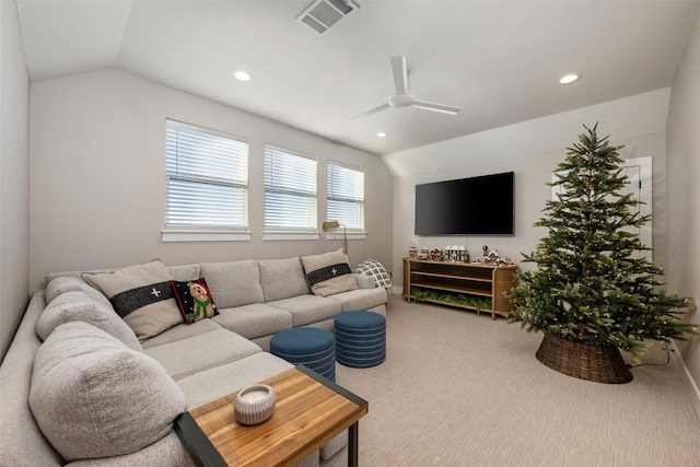 carpeted living room featuring vaulted ceiling and ceiling fan