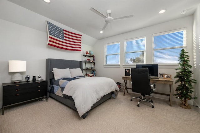 carpeted bedroom featuring ceiling fan and vaulted ceiling