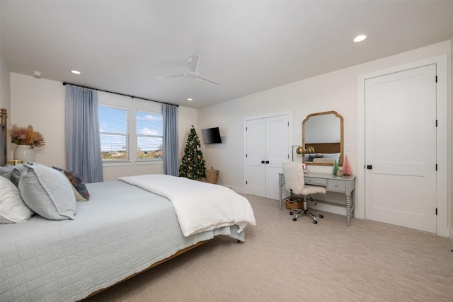 carpeted bedroom featuring ceiling fan