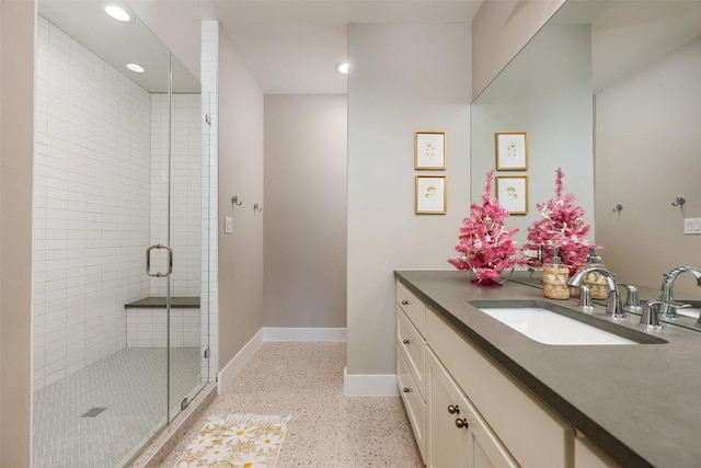 bathroom with vanity and a shower with shower door