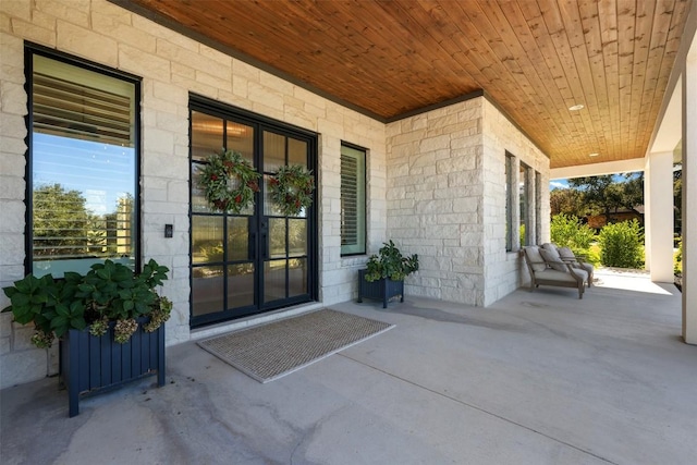 doorway to property with a porch