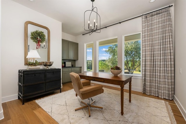 dining room featuring a chandelier and light hardwood / wood-style floors