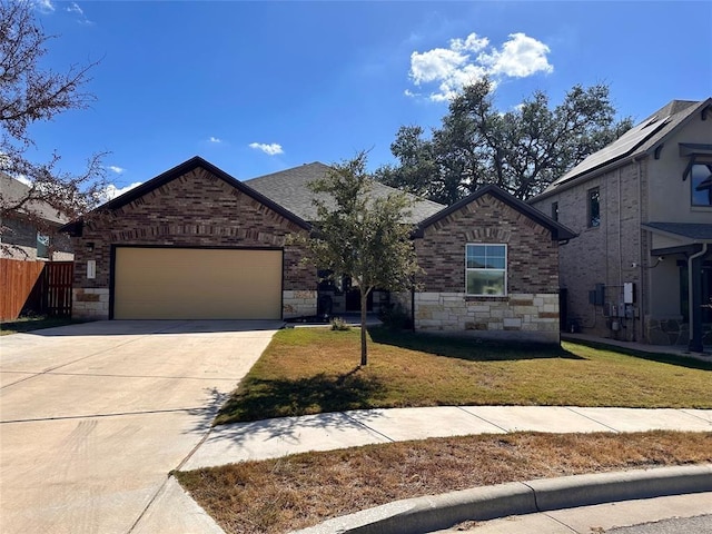 view of front of property with a garage and a front yard