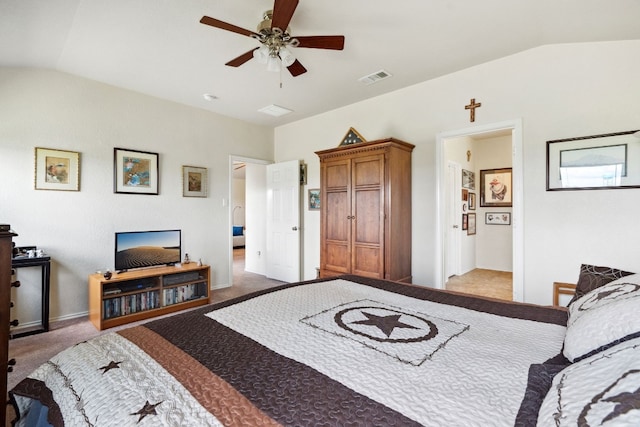 carpeted bedroom with ceiling fan, connected bathroom, and vaulted ceiling