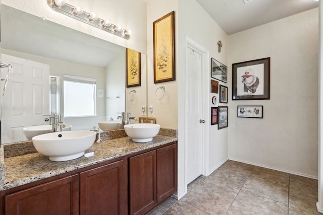 bathroom featuring tile patterned flooring and vanity