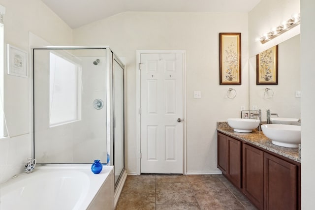 bathroom with vanity, independent shower and bath, and lofted ceiling