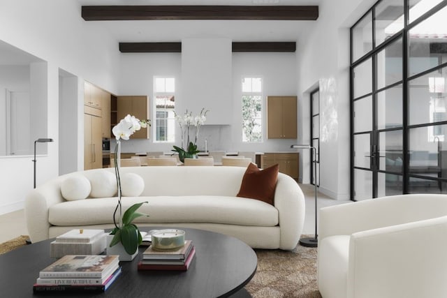 living room with beamed ceiling and a towering ceiling