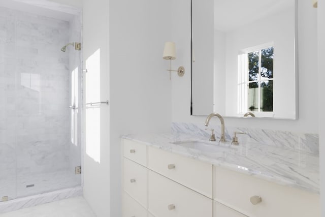 bathroom with vanity and walk in shower