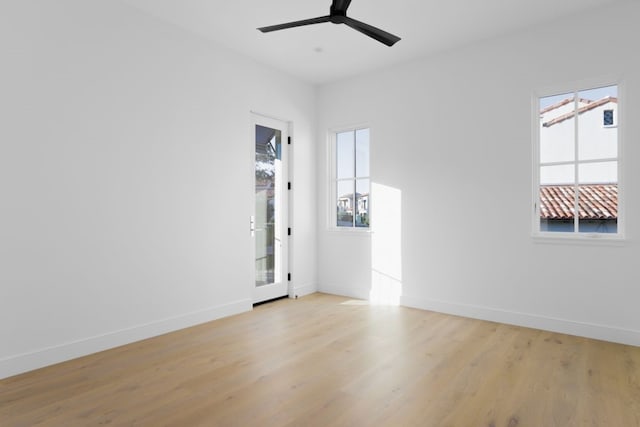 unfurnished room featuring light hardwood / wood-style floors and ceiling fan