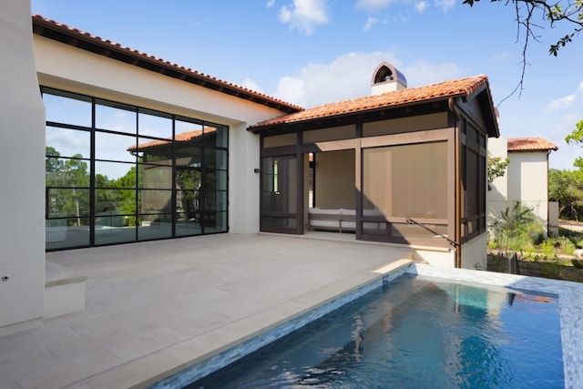 rear view of house featuring a patio area