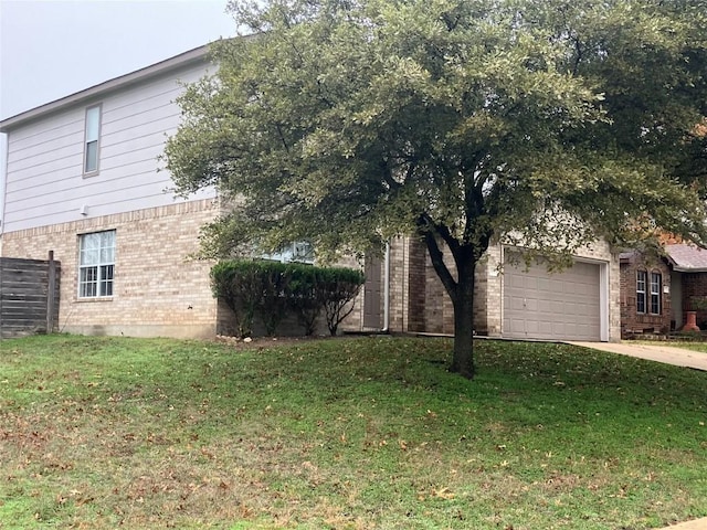 view of side of property featuring a lawn and a garage