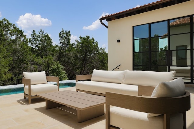 view of patio / terrace with outdoor lounge area and an outdoor pool