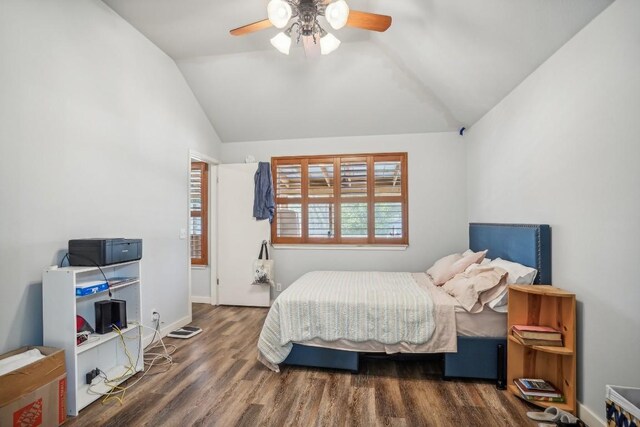 bedroom featuring vaulted ceiling, dark hardwood / wood-style floors, and ceiling fan