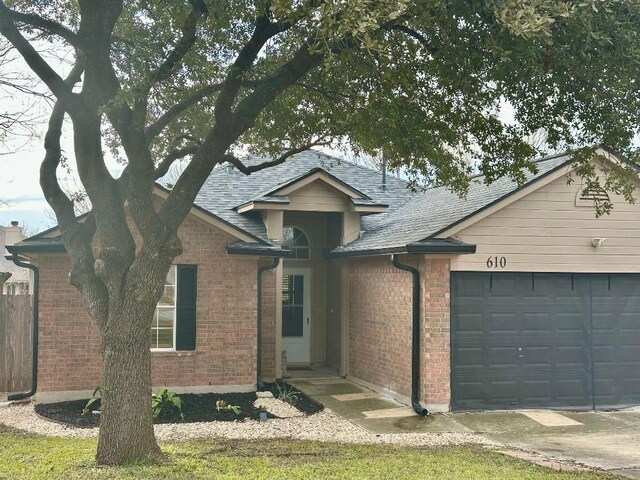 view of front of property with a garage