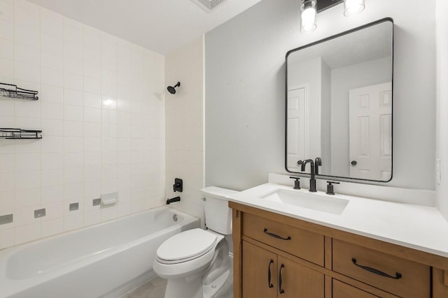 full bathroom featuring vanity, toilet, and tiled shower / bath combo