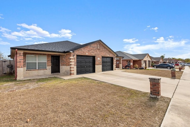 ranch-style home featuring a garage and a front lawn