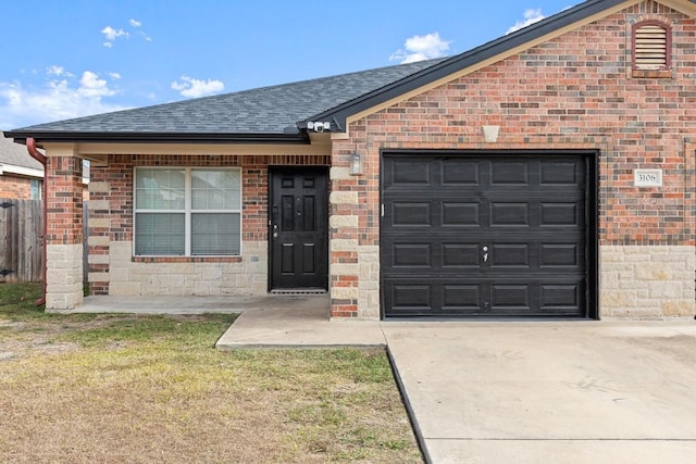 ranch-style house with a front yard and a garage