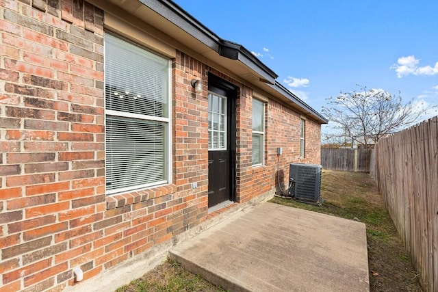 exterior space featuring a patio area and central AC