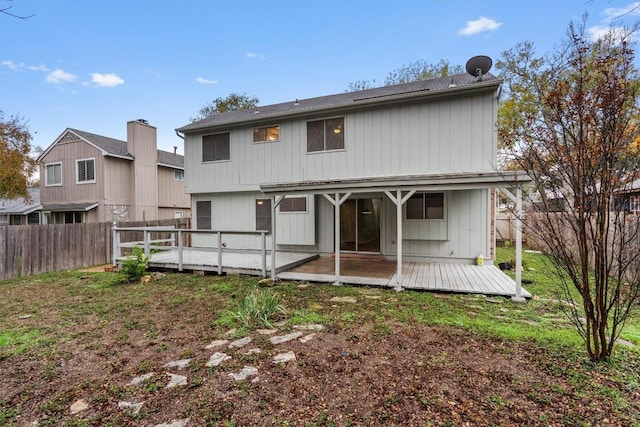 back of house featuring a deck