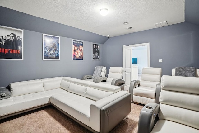 home theater room with carpet floors, a textured ceiling, and vaulted ceiling