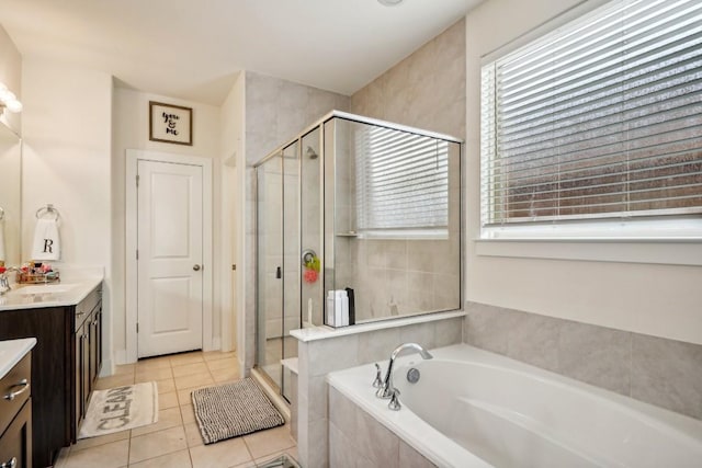 bathroom featuring tile patterned floors, vanity, and separate shower and tub