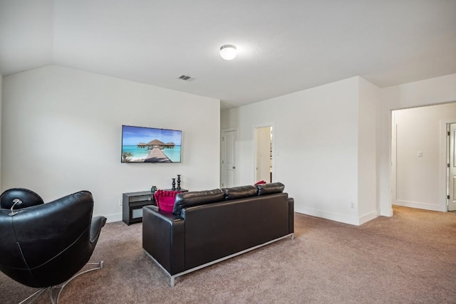 living room featuring carpet floors and lofted ceiling