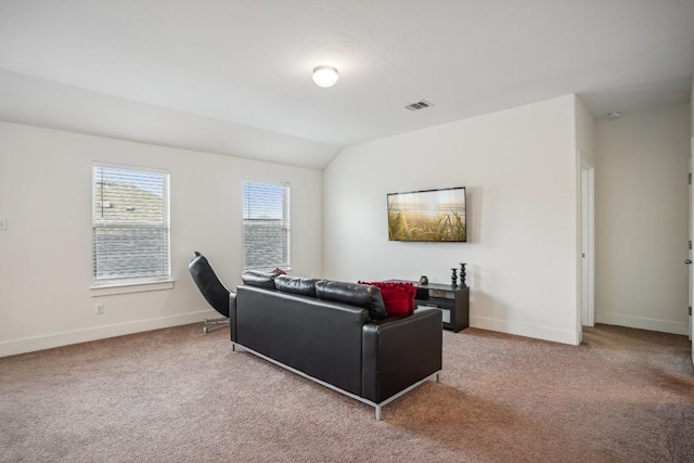 living room featuring light carpet and lofted ceiling