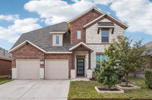 craftsman house featuring a garage and a front yard