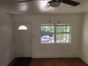 foyer featuring ceiling fan and dark hardwood / wood-style flooring