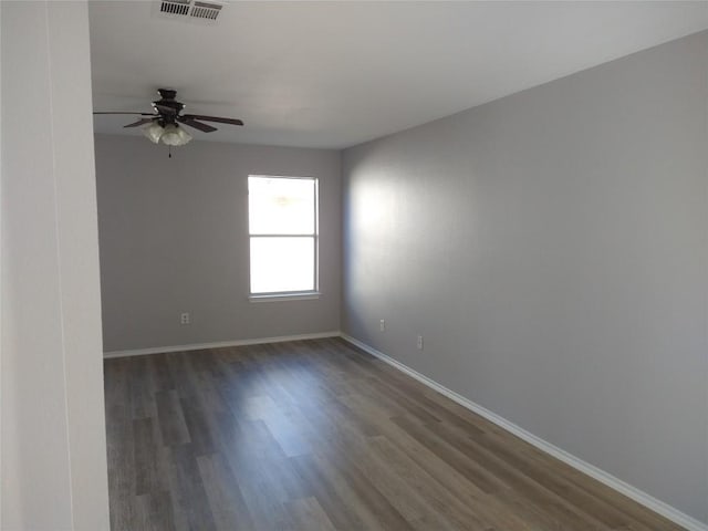 173 Ruby Lake Dr, Kyle, TX 78640 - unfurnished room with a ceiling fan, wood finished floors, and baseboards