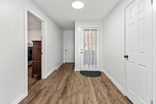 doorway to outside with dark hardwood / wood-style flooring