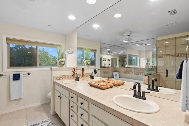 bathroom featuring a shower stall, visible vents, and a sink