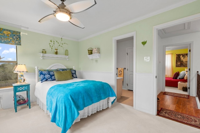 bedroom with ceiling fan, wood finished floors, and crown molding