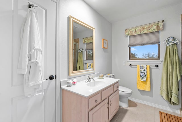 full bathroom featuring baseboards, toilet, a shower with shower door, tile patterned flooring, and vanity