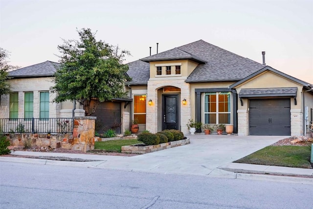 view of front of property with a garage