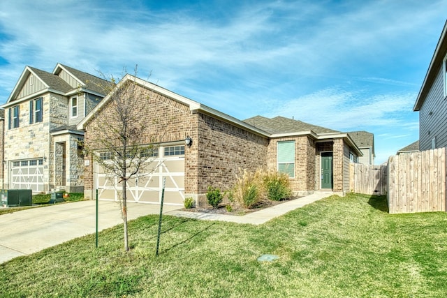 view of front of home with a garage and a front lawn