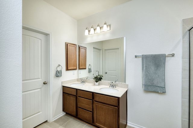 bathroom with tile patterned floors, a shower with door, and vanity