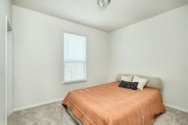 bedroom featuring light colored carpet