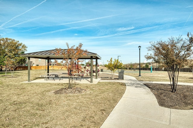 view of property's community featuring a lawn and a gazebo