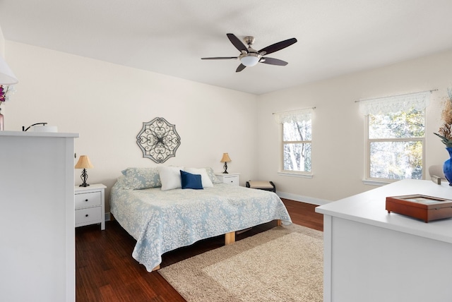 bedroom featuring dark hardwood / wood-style flooring and ceiling fan