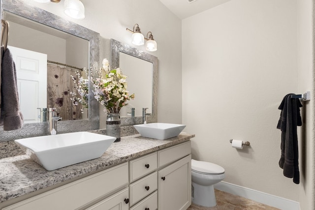 bathroom with tile patterned flooring, vanity, toilet, and a shower with shower curtain