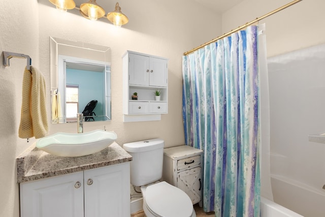 full bathroom with vanity, shower / bath combination with curtain, and toilet