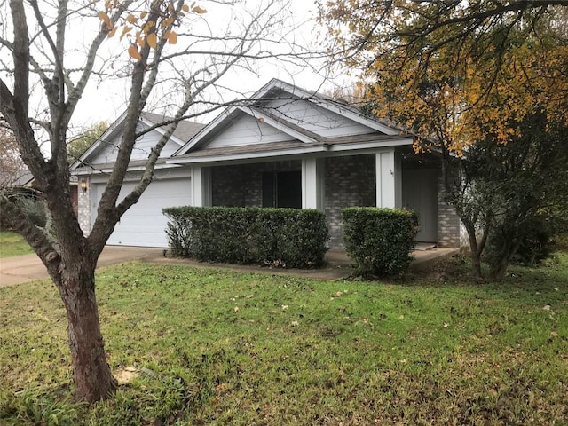 view of front of house with a garage and a front yard