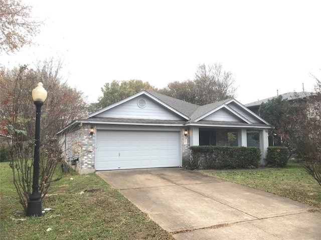 ranch-style house with a front yard and a garage