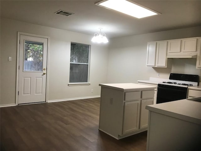 kitchen with white cabinetry, electric range, dark hardwood / wood-style floors, a notable chandelier, and decorative light fixtures