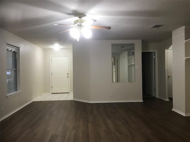 empty room featuring ceiling fan and wood-type flooring