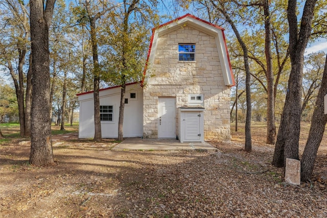 120 Laguna, Smithville, TX 78957 - rear view of house with stone siding