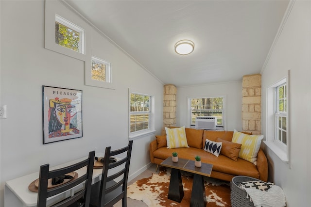 120 Laguna, Smithville, TX 78957 - living area featuring ornamental molding, vaulted ceiling, and cooling unit